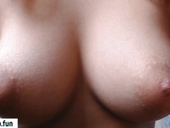 Asian babe shows off perfect natural breasts