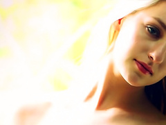 Slender blonde steps into shower