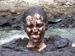 Busty Samantha gets very dirty outdoors in pool of mud