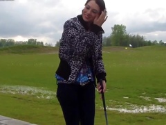 Naughty brunette showing her nice natural tits in public place