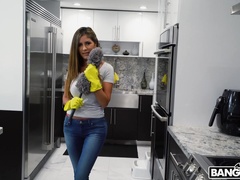 Busty woman stops cleaning around the house to pose nude