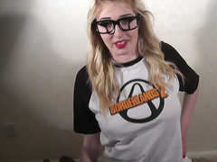 Lusty blonde gamer in glasses masturbates with joystick and a dildo