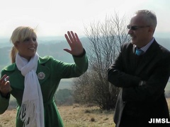 Vivacious babe with big fake tits playing with an old man's cock