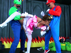 Two gamers are penetrating this spicy brunette